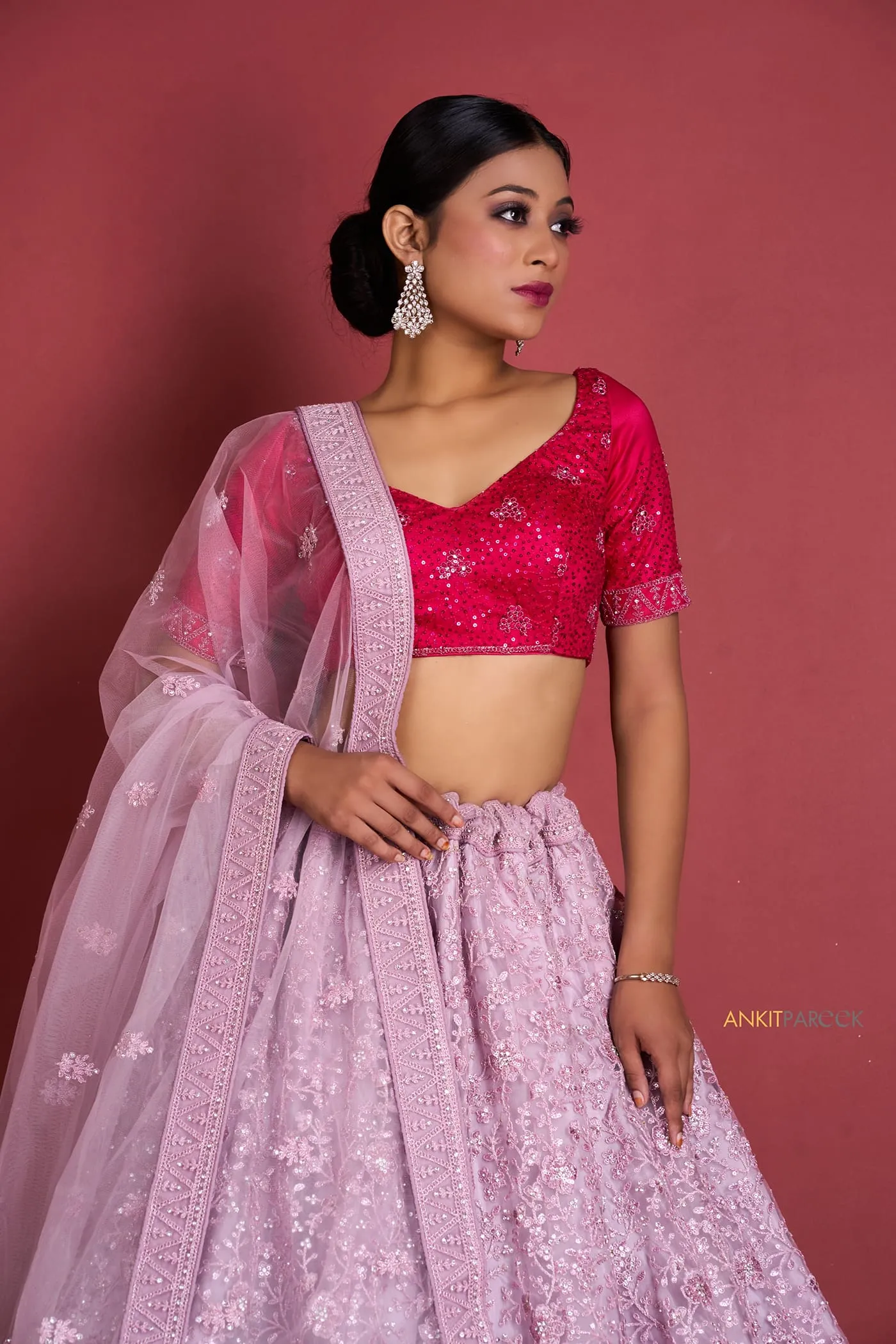 Nine lehengas, one backdrop, one light - a catalogue set that reads as a range.